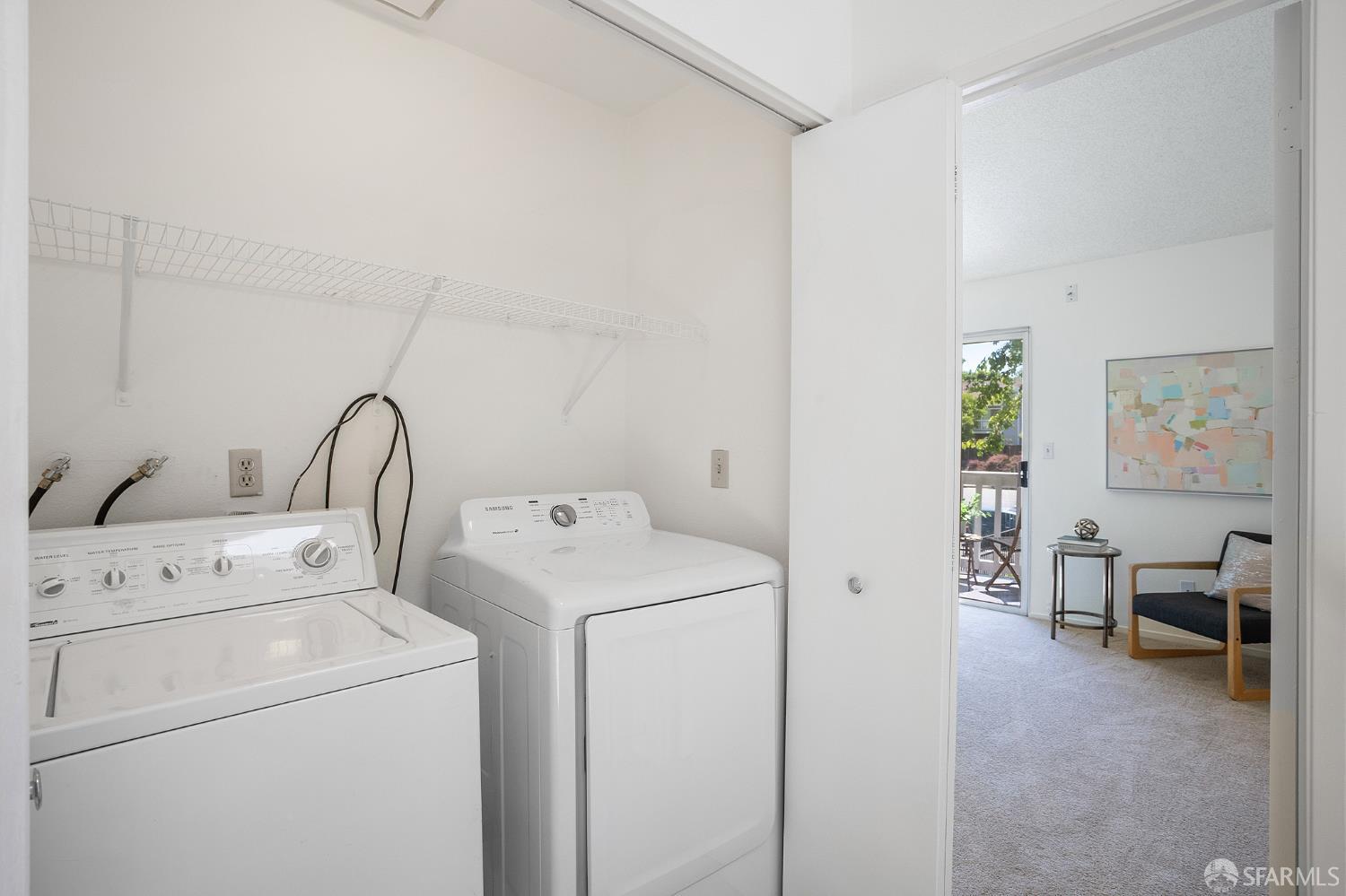 3937 Vine Street Pleasanton, CA 94566 - Photo 22 of 30 a view of washer and dryer with bathroom in the background