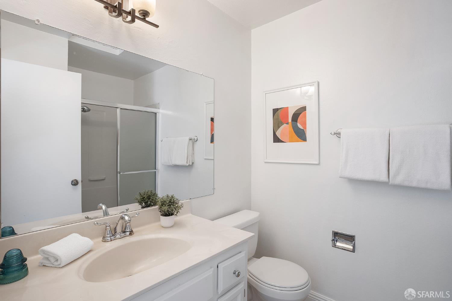 3937 Vine Street Pleasanton, CA 94566 - Photo 23 of 30 a bathroom with a sink vanity mirror and toilet