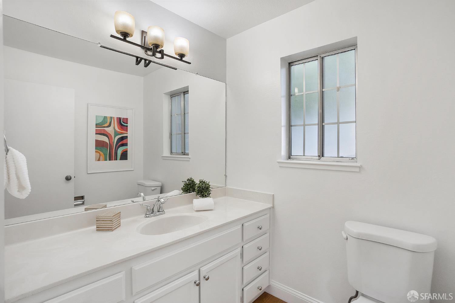 3937 Vine Street Pleasanton, CA 94566 - Photo 8 of 30 a bathroom with a sink vanity and a mirror