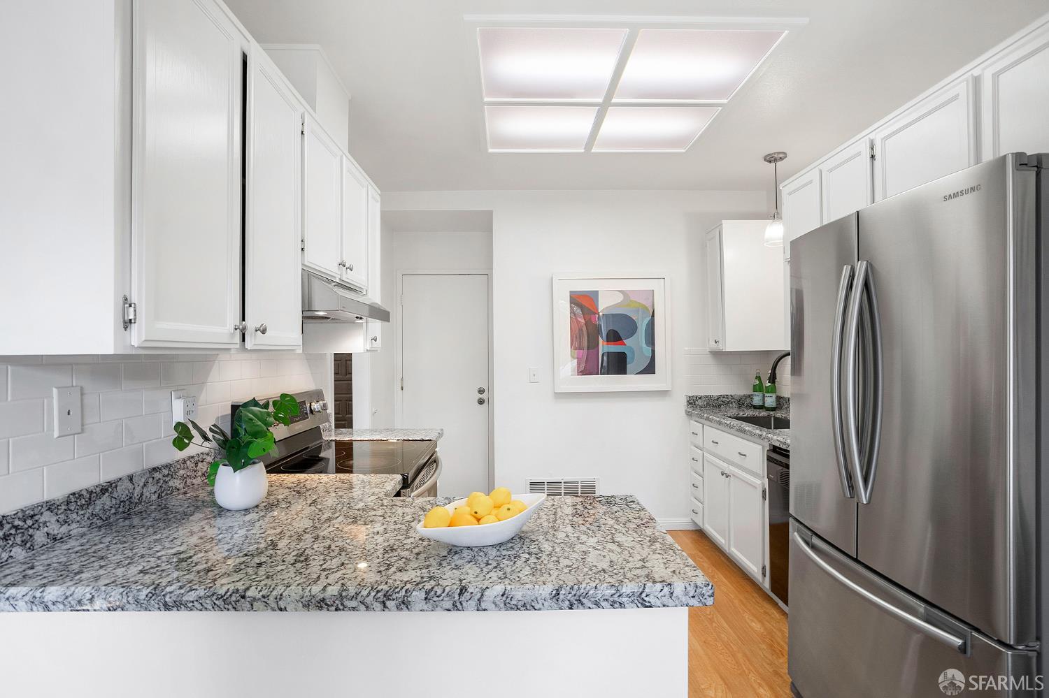 3937 Vine Street Pleasanton, CA 94566 - Photo 9 of 30 a kitchen with a refrigerator and countertop