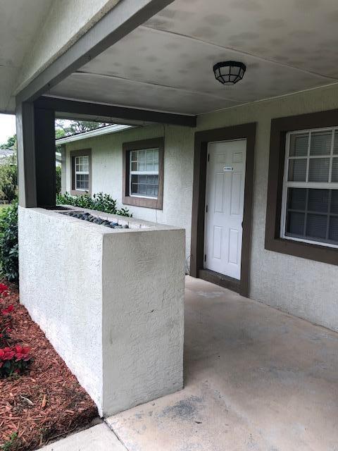 7407 Sebastian Road Fort Pierce, FL 34951 - Photo 4 of 13 a view of house and front door