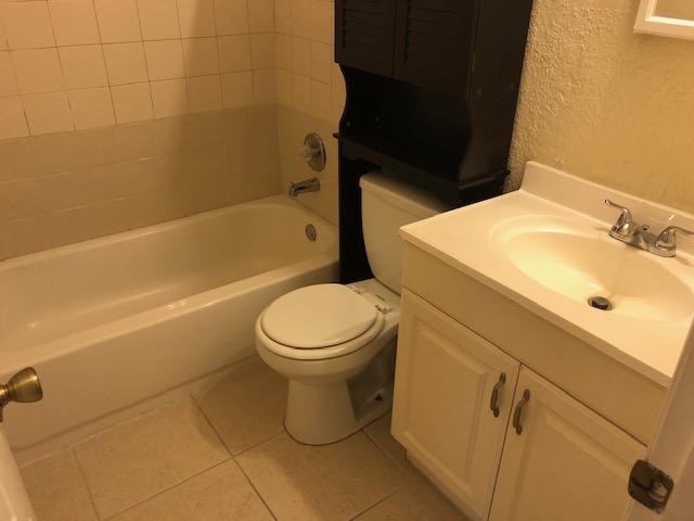 7407 Sebastian Road Fort Pierce, FL 34951 - Photo 9 of 13 a bathroom with a sink toilet and shower