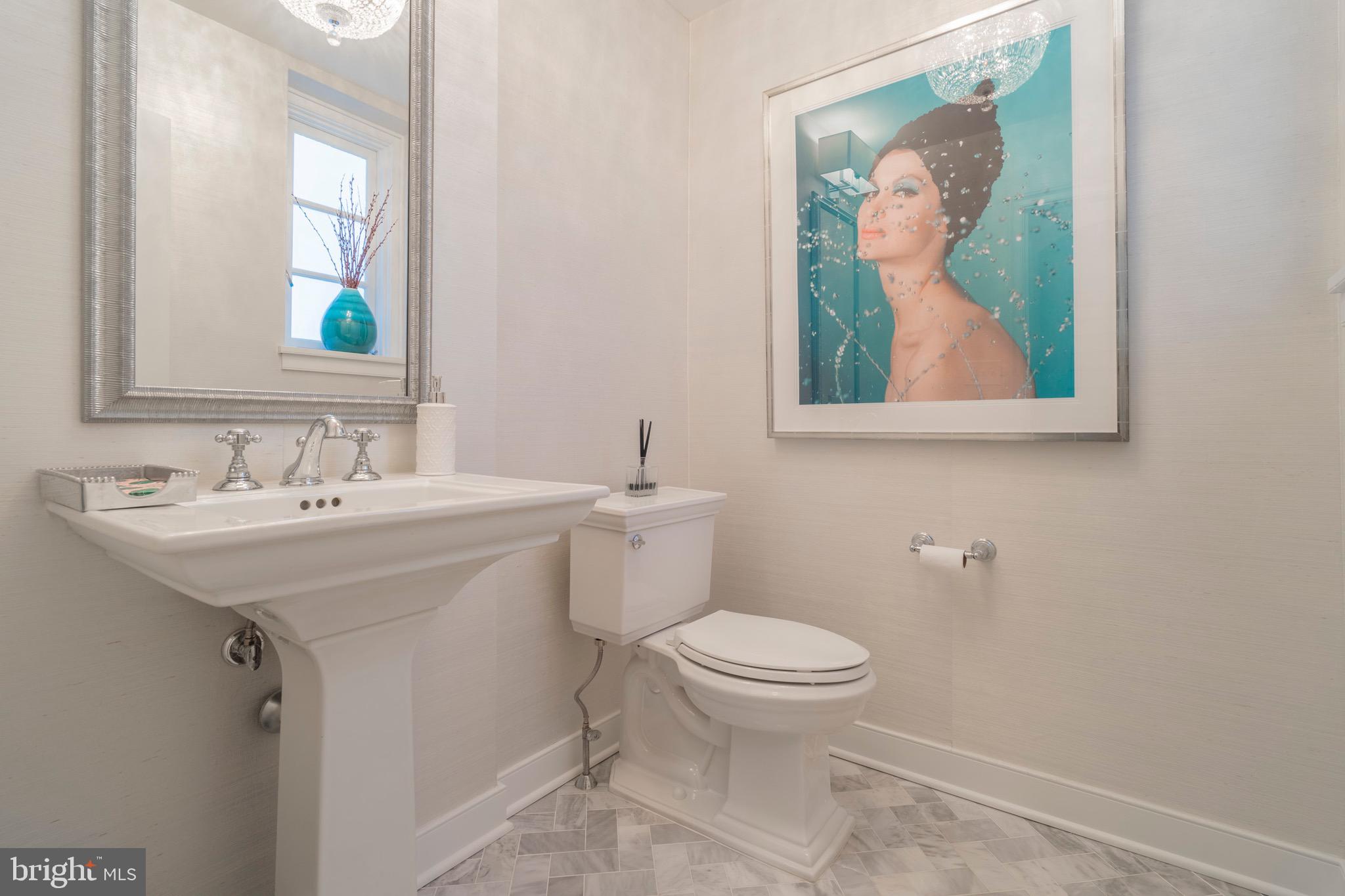 445 Caversham Road Bryn Mawr, PA 19010 - Photo 8 of 39 Powder room with herringbone marble floor.