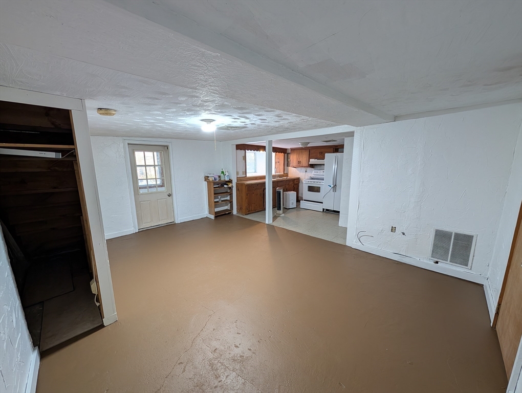 7 Little Mugget Road Charlton, MA 01507 - Photo 15 of 42 a view of a livingroom with furniture and a ceiling fan