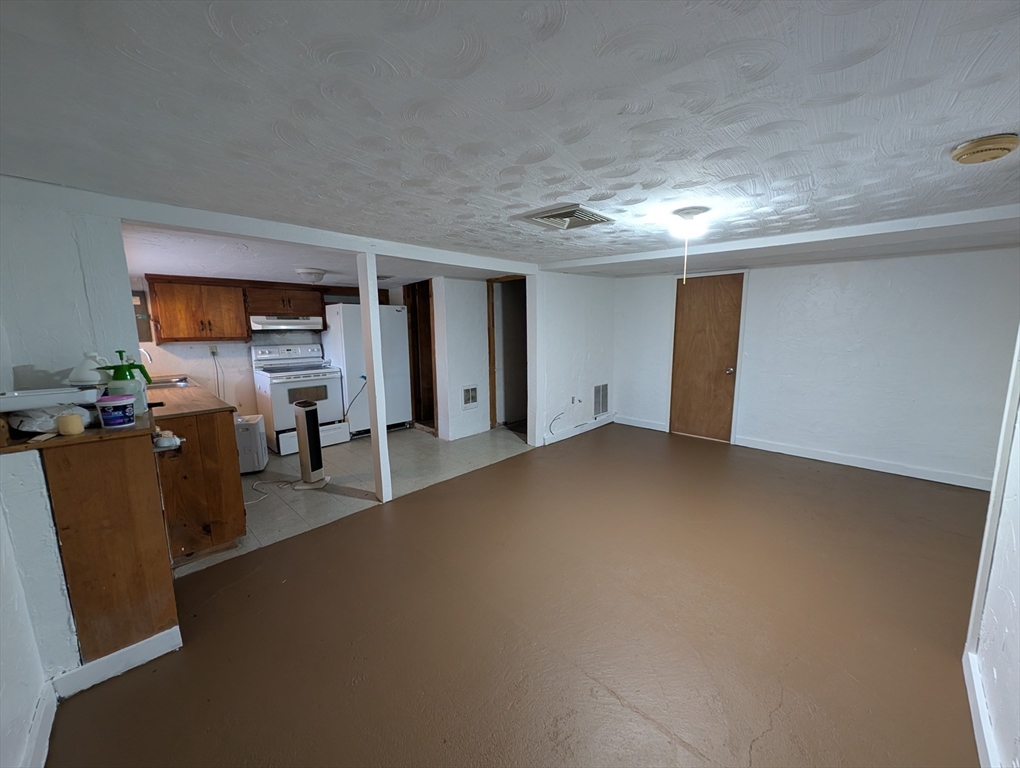 7 Little Mugget Road Charlton, MA 01507 - Photo 17 of 42 a view of a livingroom with furniture and a window