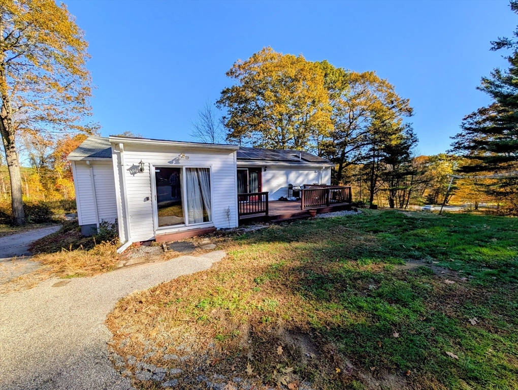 7 Little Mugget Road Charlton, MA 01507 - Photo 24 of 42 a view of a house with a backyard