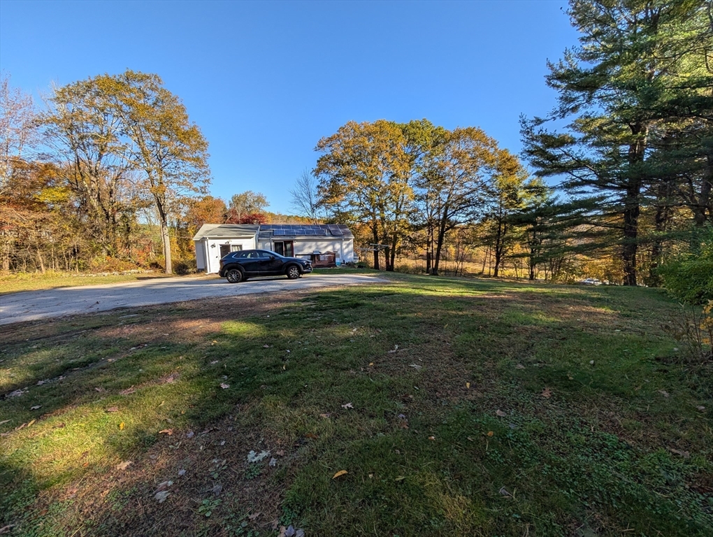 7 Little Mugget Road Charlton, MA 01507 - Photo 28 of 42 a view of a house with a big yard