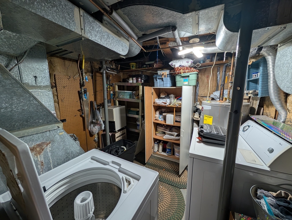 7 Little Mugget Road Charlton, MA 01507 - Photo 37 of 42 a view of walk in closet with clothes and shoes