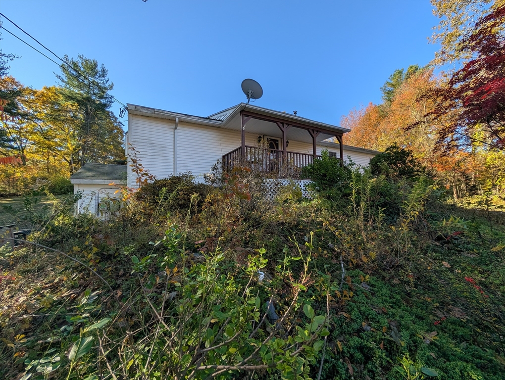 7 Little Mugget Road Charlton, MA 01507 - Photo 38 of 42 a front view of a house with a yard