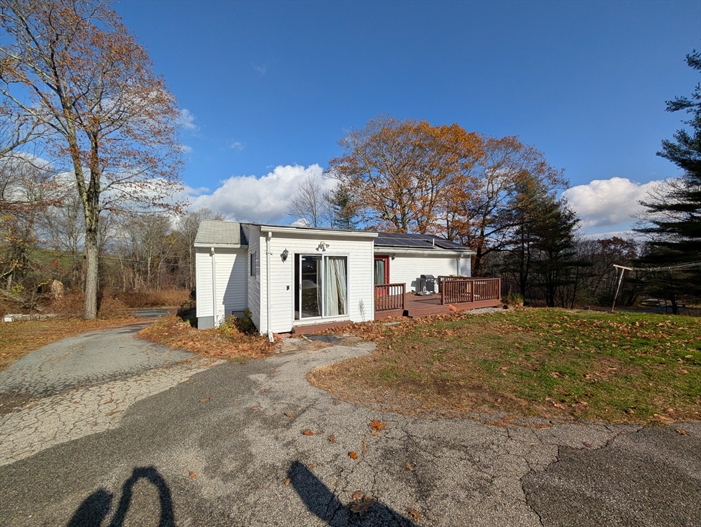 7 Little Mugget Road Charlton, MA 01507 - Photo 42 of 42 a front view of a house with a yard and garage