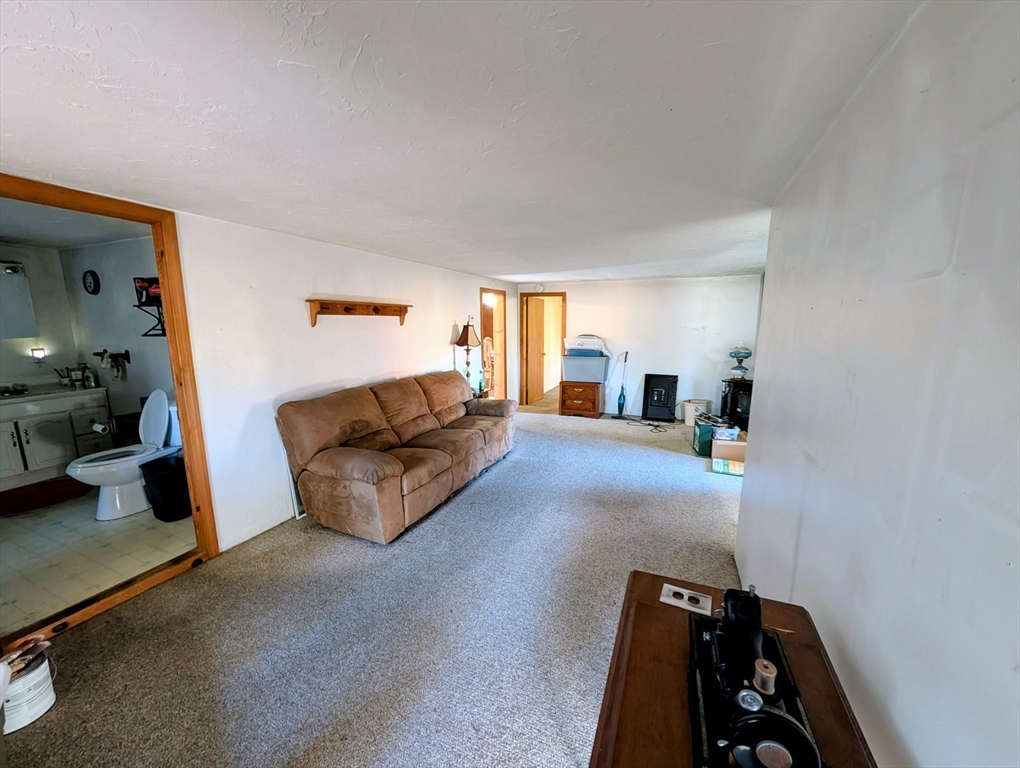 7 Little Mugget Road Charlton, MA 01507 - Photo 6 of 42 a living room with furniture and a mirror