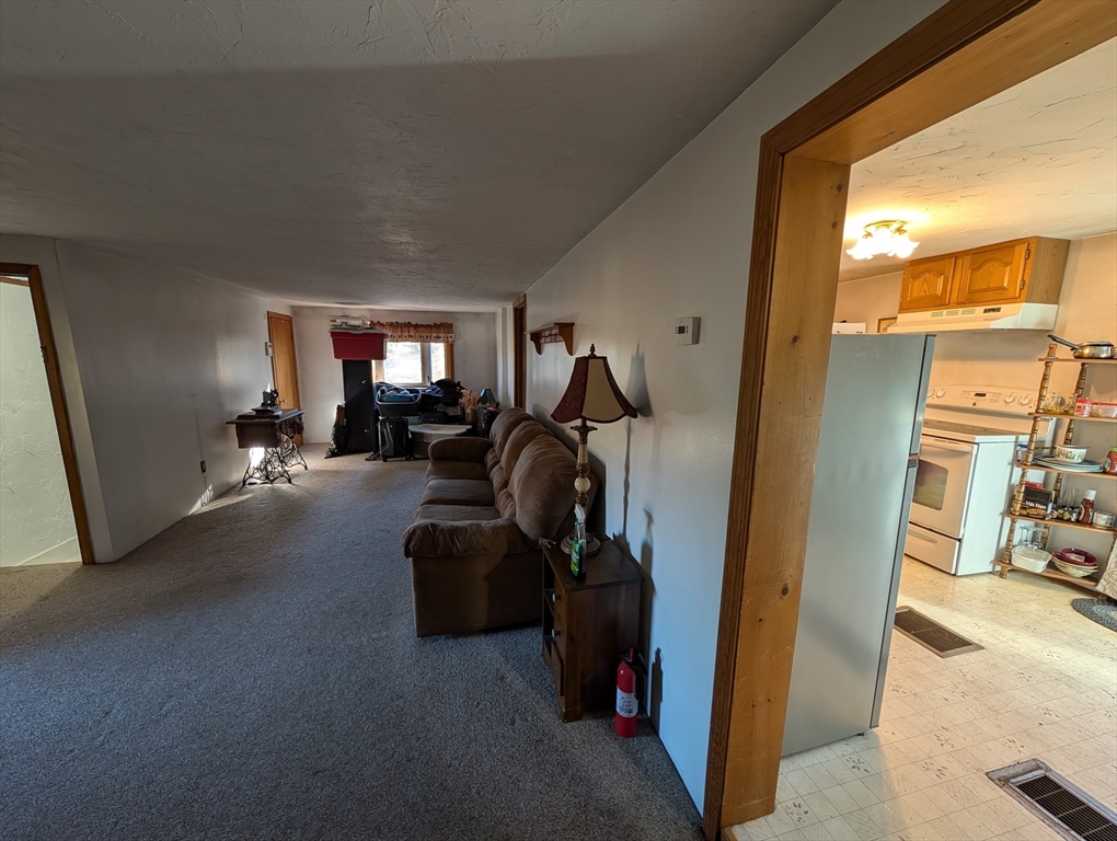 7 Little Mugget Road Charlton, MA 01507 - Photo 8 of 42 a view of living room with furniture and a window