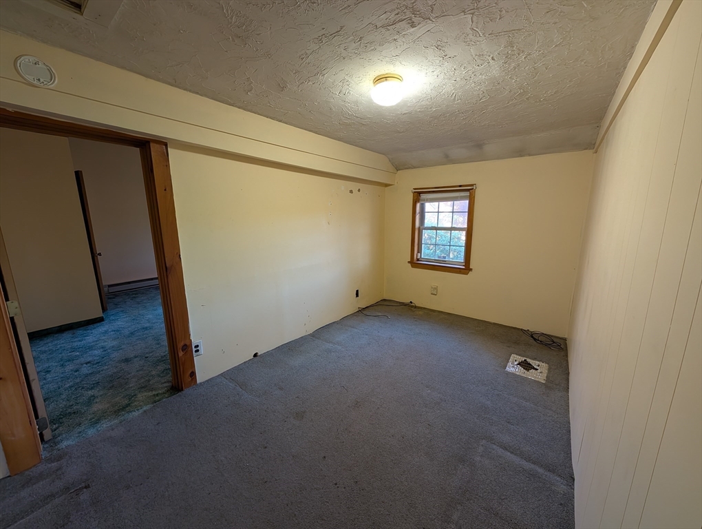 7 Little Mugget Road Charlton, MA 01507 - Photo 10 of 42 an empty room with windows