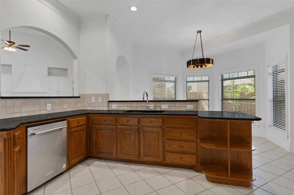 1714 Morrish Lane Heath, TX 75032 - Photo 11 of 33 a kitchen with cabinets and window