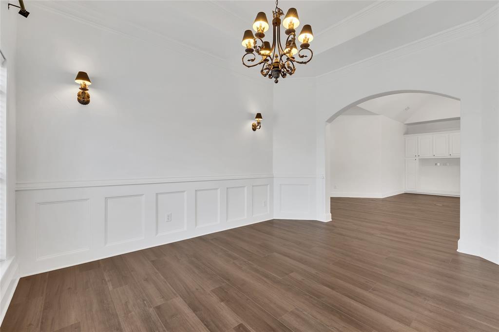 1714 Morrish Lane Heath, TX 75032 - Photo 15 of 33 a view of an empty room with wooden floor