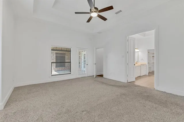 a spacious bathroom with a double vanity sink mirror and double