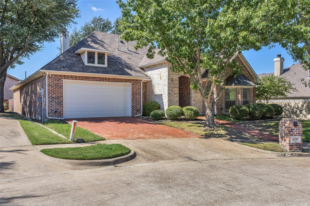 1714 Morrish Lane Heath, TX 75032 - Photo 2 of 33 a front view of a house with garden