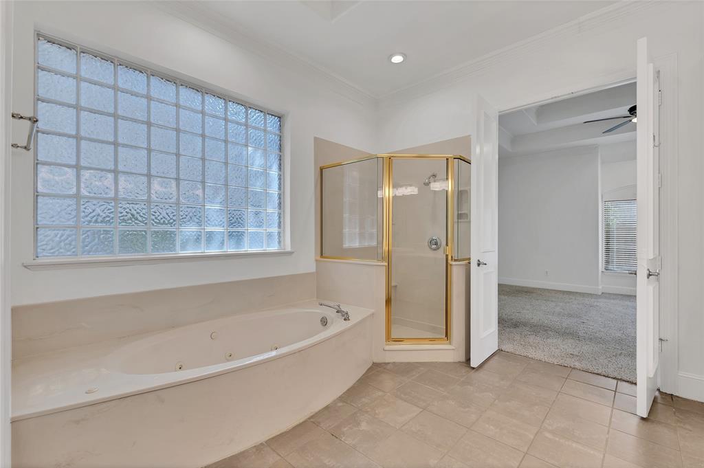 1714 Morrish Lane Heath, TX 75032 - Photo 21 of 33 a spacious bathroom with a bathtub and a shower