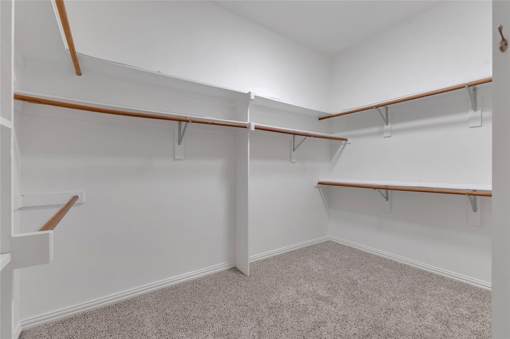 1714 Morrish Lane Heath, TX 75032 - Photo 22 of 33 a view of an empty walk in closet