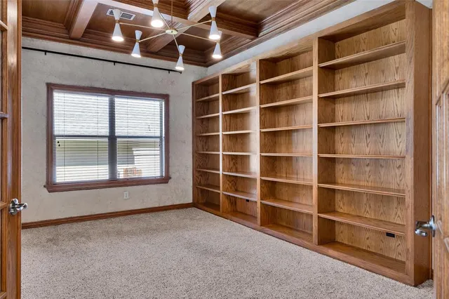a bathroom with a sink a mirror and a potted plant