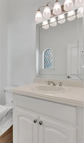 a view of a kitchen with white cabinets