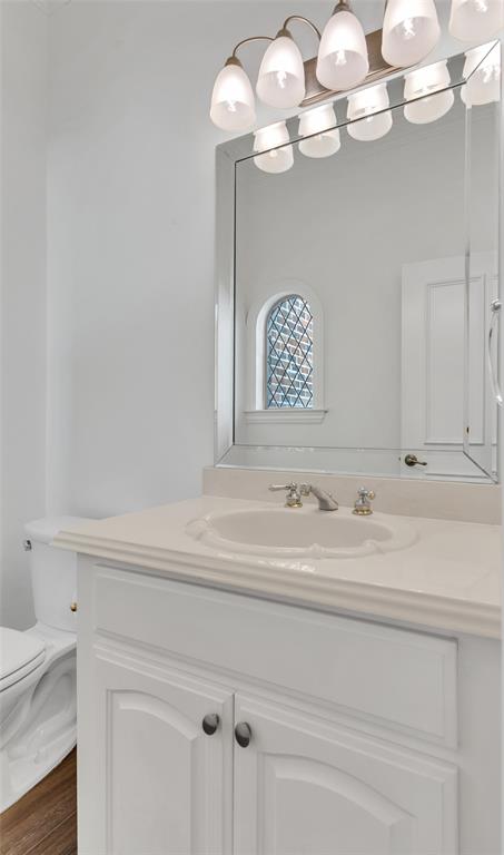 1714 Morrish Lane Heath, TX 75032 - Photo 24 of 33 a bathroom with a sink a mirror and a potted plant
