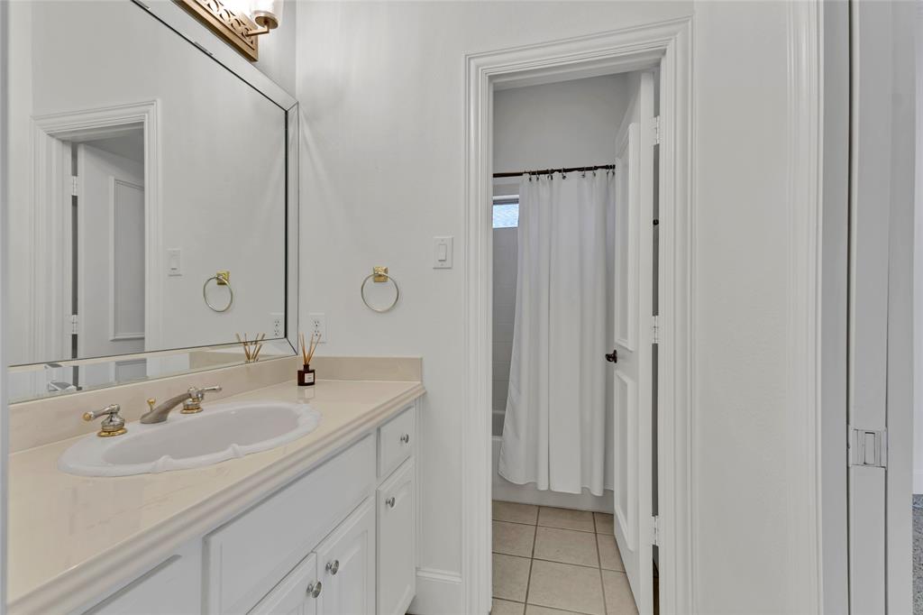 1714 Morrish Lane Heath, TX 75032 - Photo 27 of 33 a bathroom with a sink and a mirror