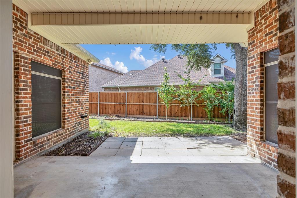 1714 Morrish Lane Heath, TX 75032 - Photo 28 of 33 a view of a backyard with a garden and plants