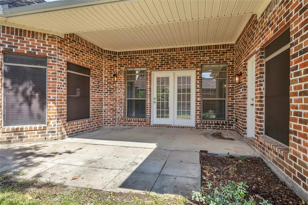 1714 Morrish Lane Heath, TX 75032 - Photo 29 of 33 front view of a brick house with a large window