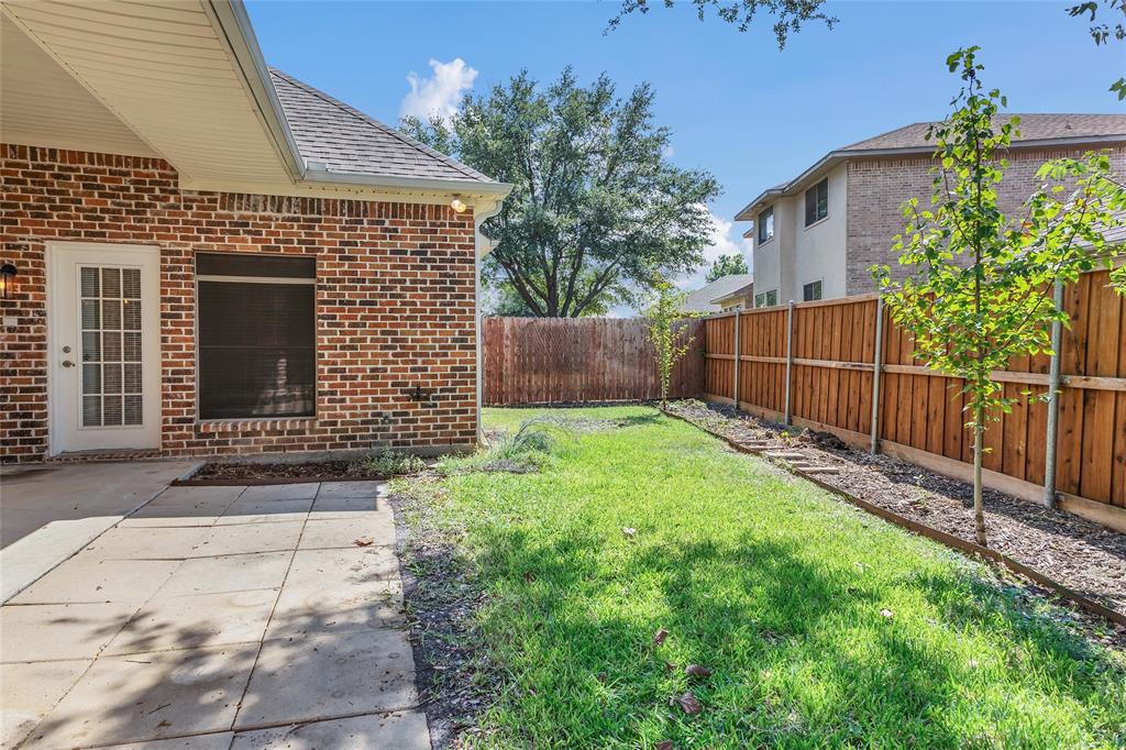 1714 Morrish Lane Heath, TX 75032 - Photo 30 of 33 a front view of a house with garden