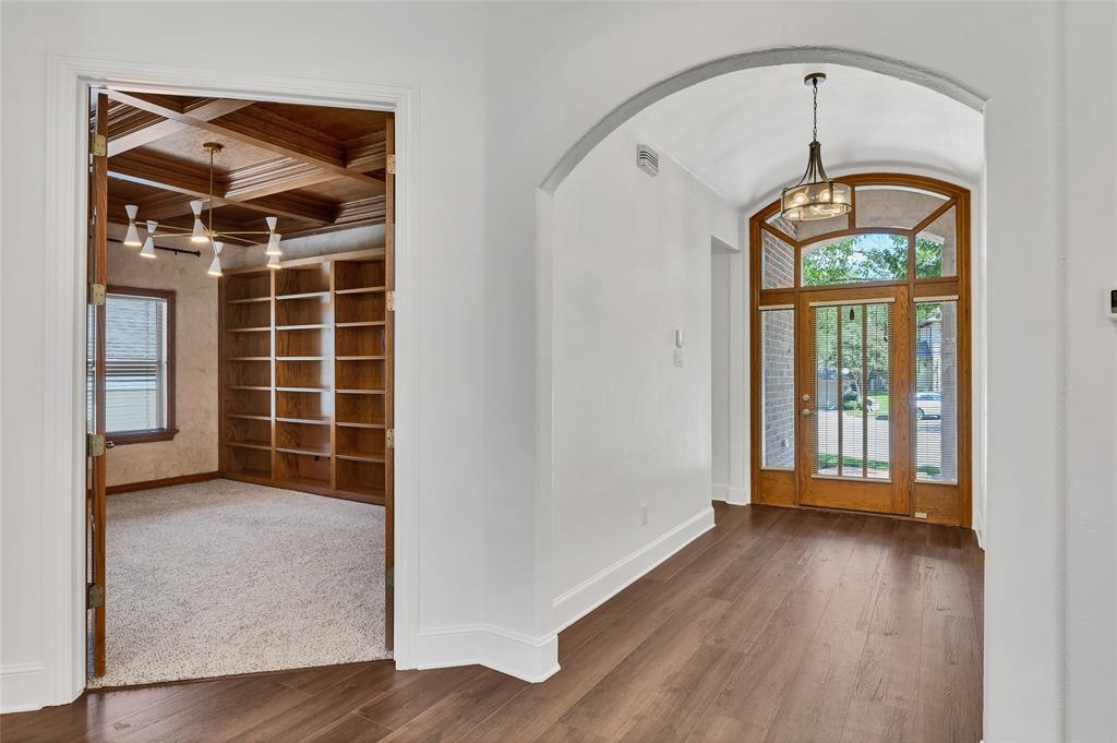 1714 Morrish Lane Heath, TX 75032 - Photo 4 of 33 a view of a hallway with wooden floor and a window