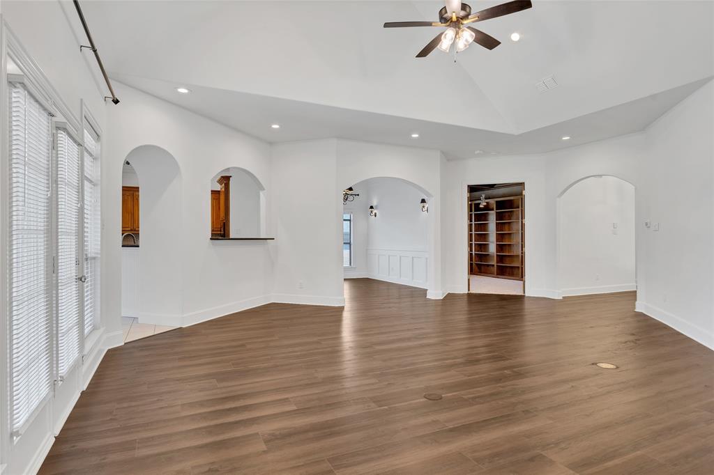 1714 Morrish Lane Heath, TX 75032 - Photo 6 of 33 a view of an empty room with window and wooden floor