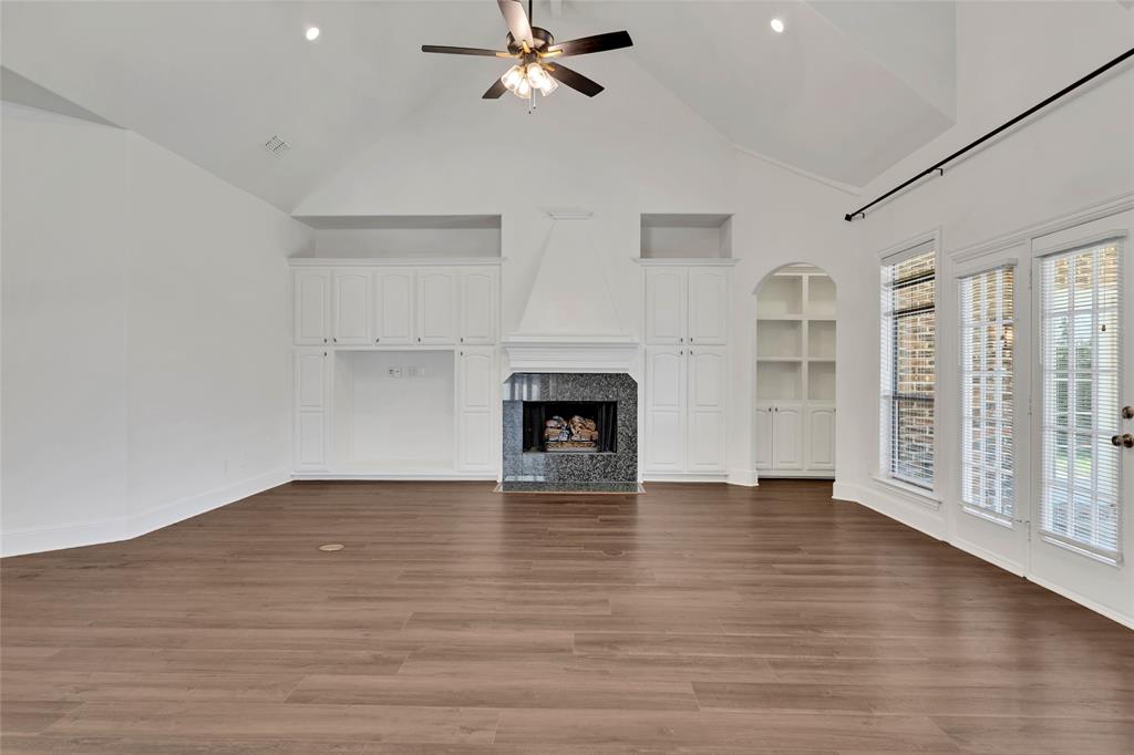 1714 Morrish Lane Heath, TX 75032 - Photo 7 of 33 a view of an empty room with a window and wooden floor