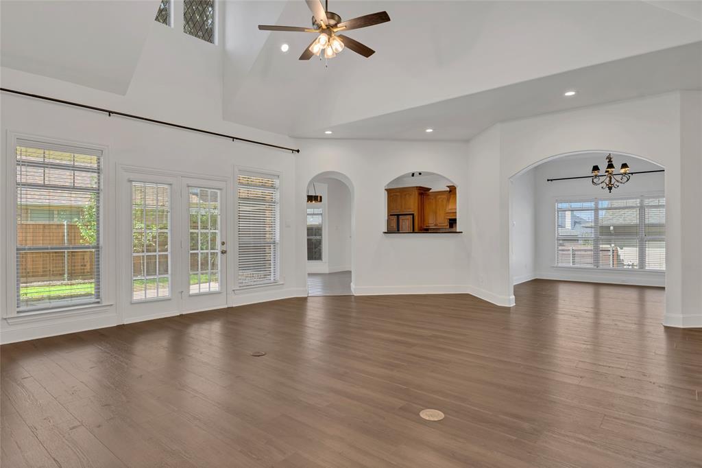 1714 Morrish Lane Heath, TX 75032 - Photo 8 of 33 a view of an empty room with wooden floor and a window