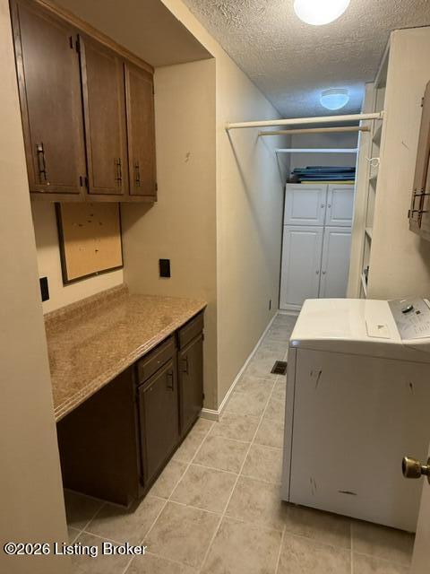 8605 Blue Lick Road Louisville, KY 40219 - Photo 21 of 28 Laundry Rm with built-in folding counter, cabinets, and shelving