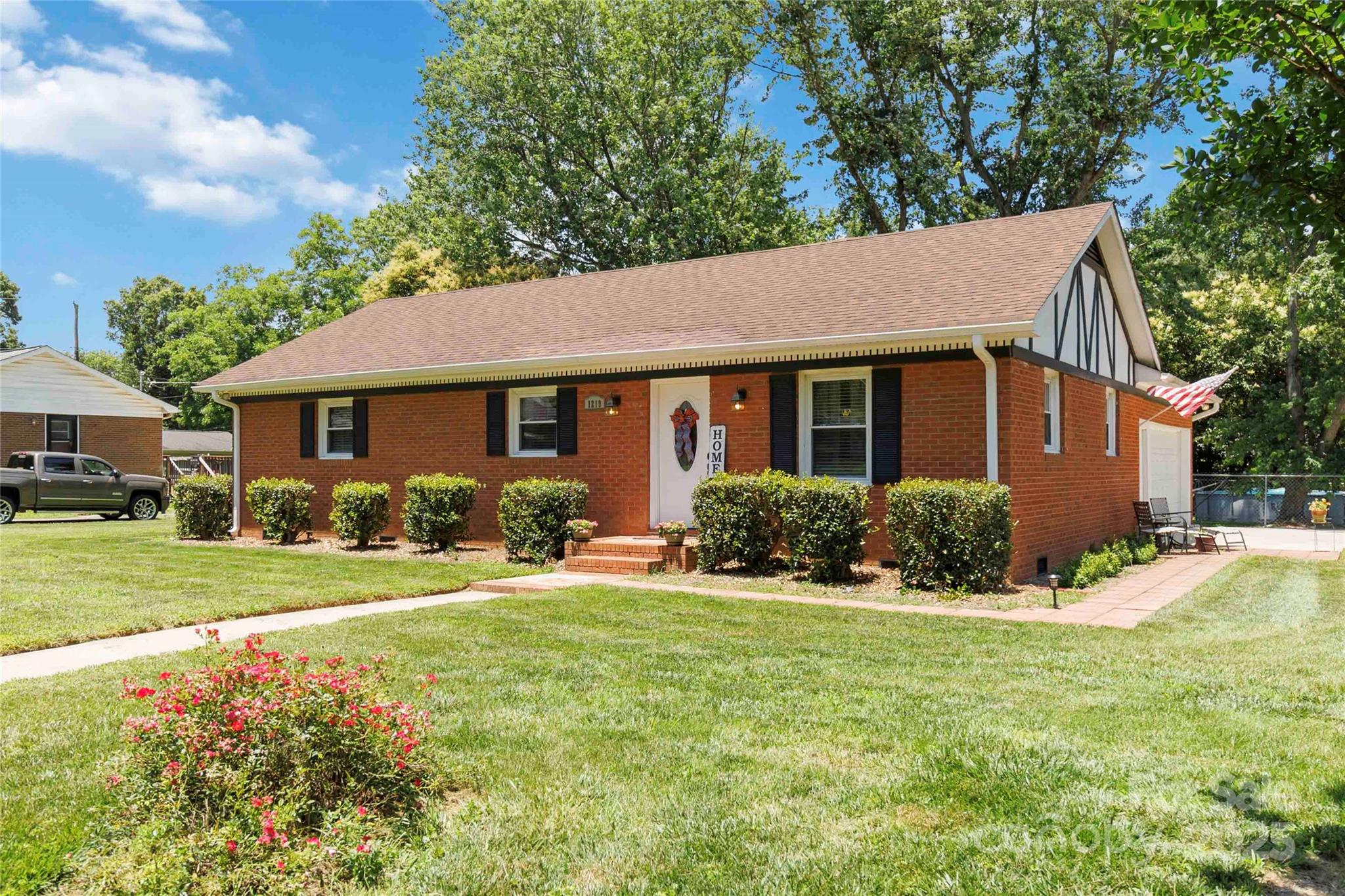1219 Flowe Drive Matthews, NC 28104 - Photo 1 of 30 a front view of a house with a yard