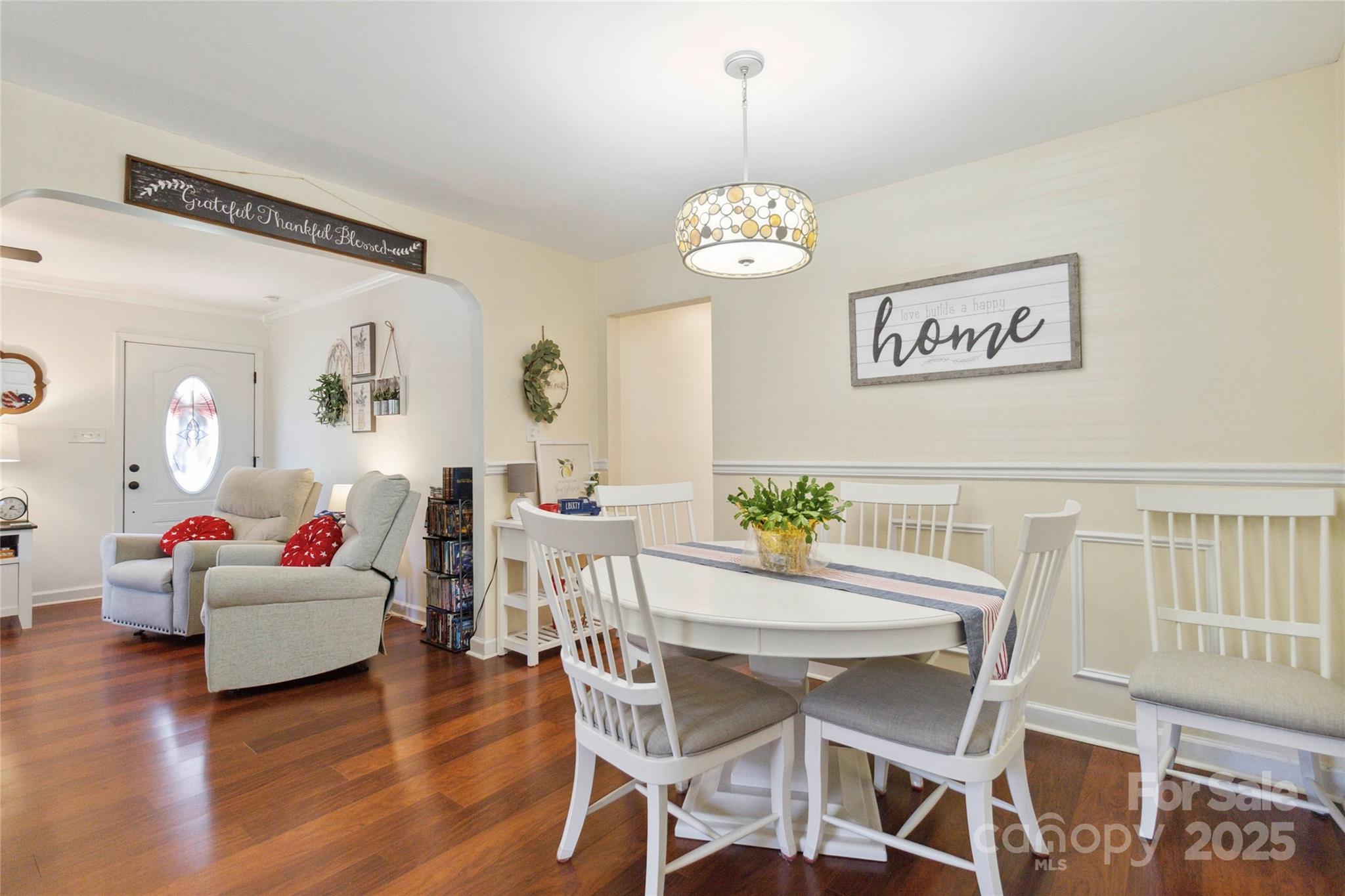 1219 Flowe Drive Matthews, NC 28104 - Photo 13 of 30 a view of a dining room with furniture wooden floor and a chandelier