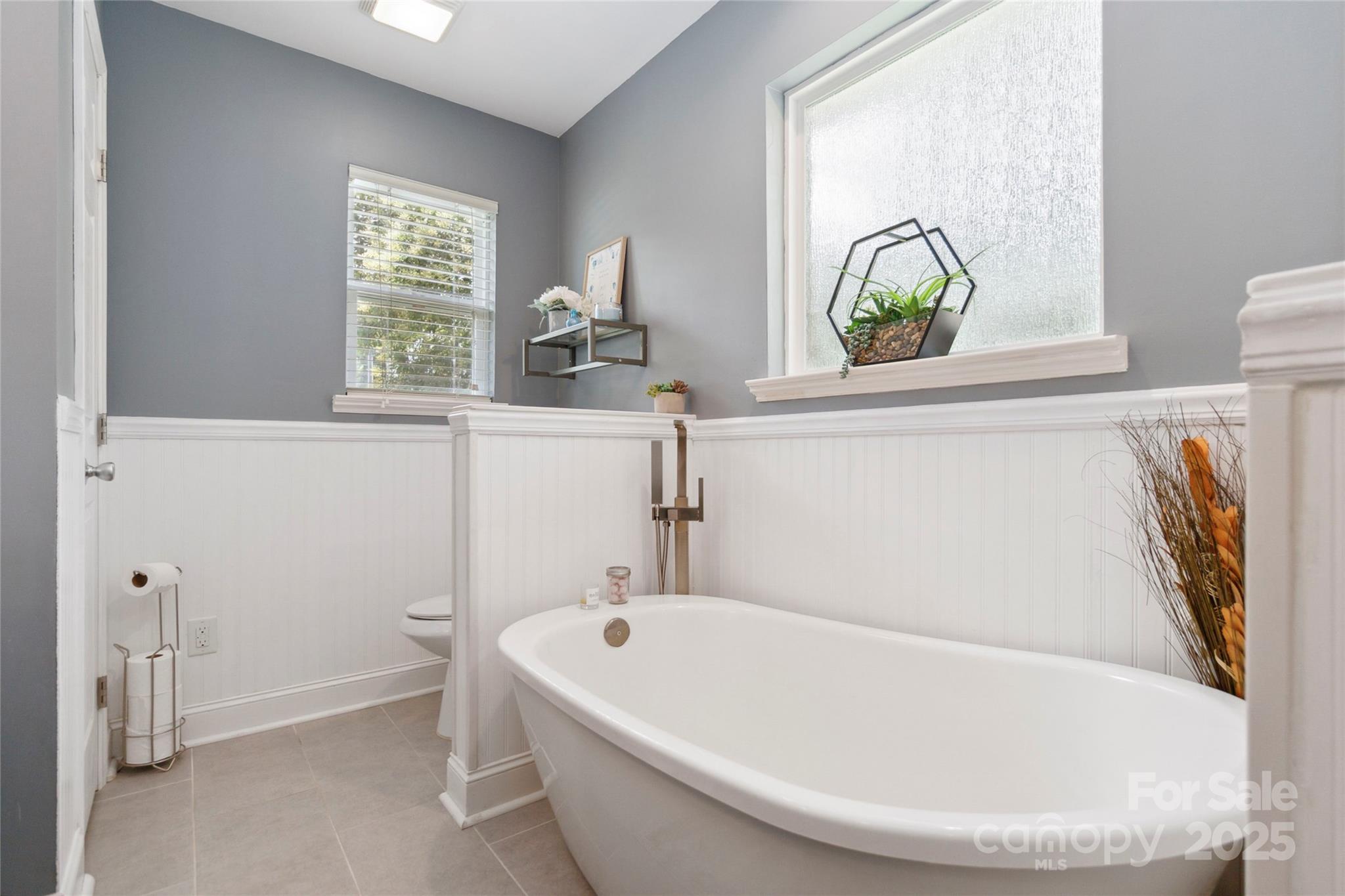 1219 Flowe Drive Matthews, NC 28104 - Photo 16 of 30 a white bath tub with a window