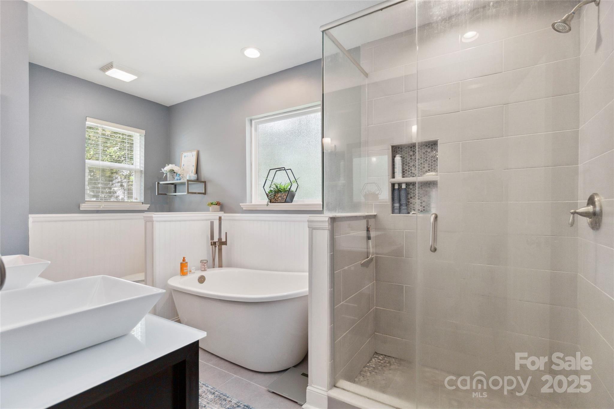 1219 Flowe Drive Matthews, NC 28104 - Photo 17 of 30 a bathroom with a sink toilet a mirror and shower