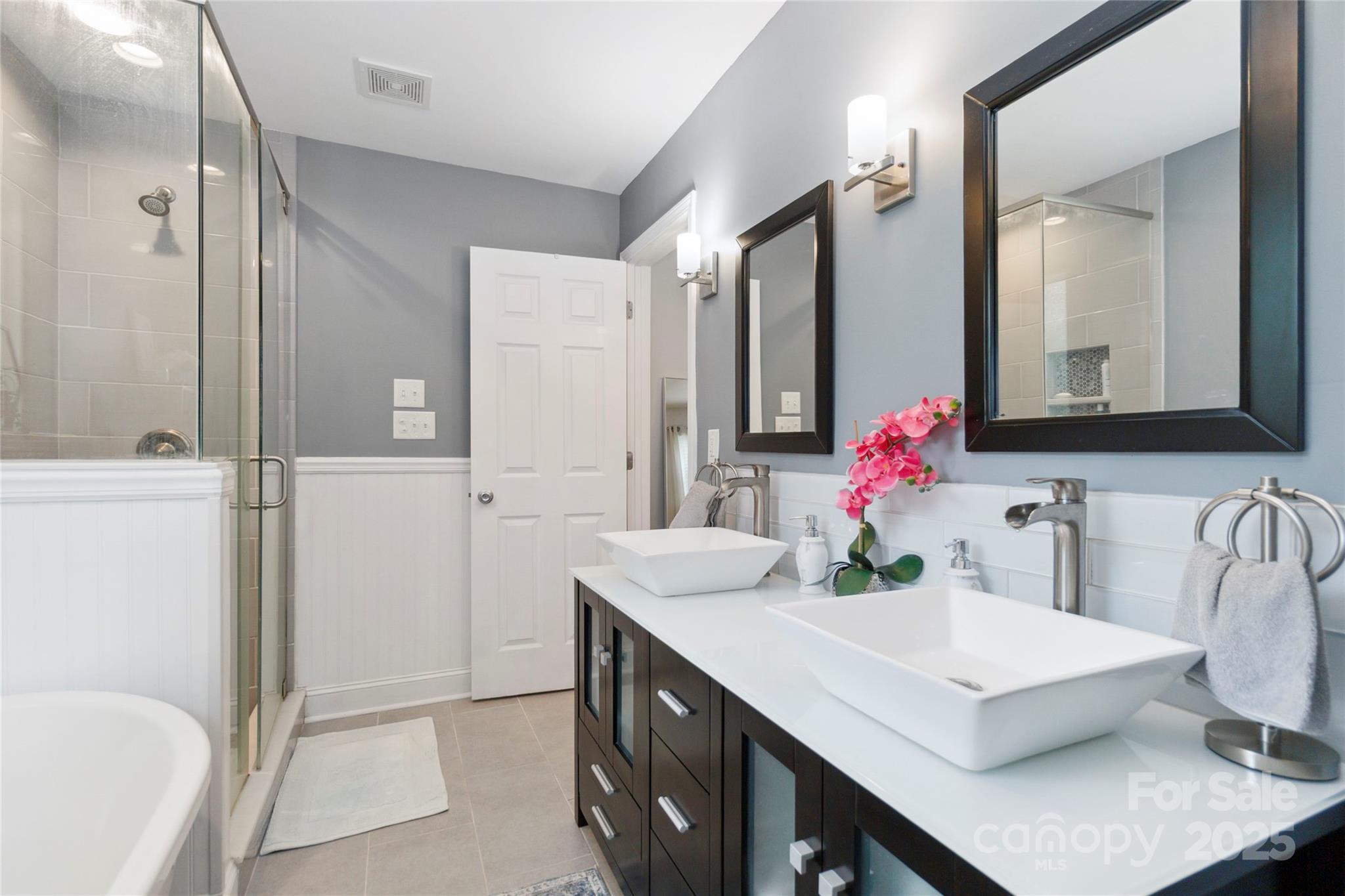 1219 Flowe Drive Matthews, NC 28104 - Photo 18 of 30 a bathroom with a sink vanity tub and shower