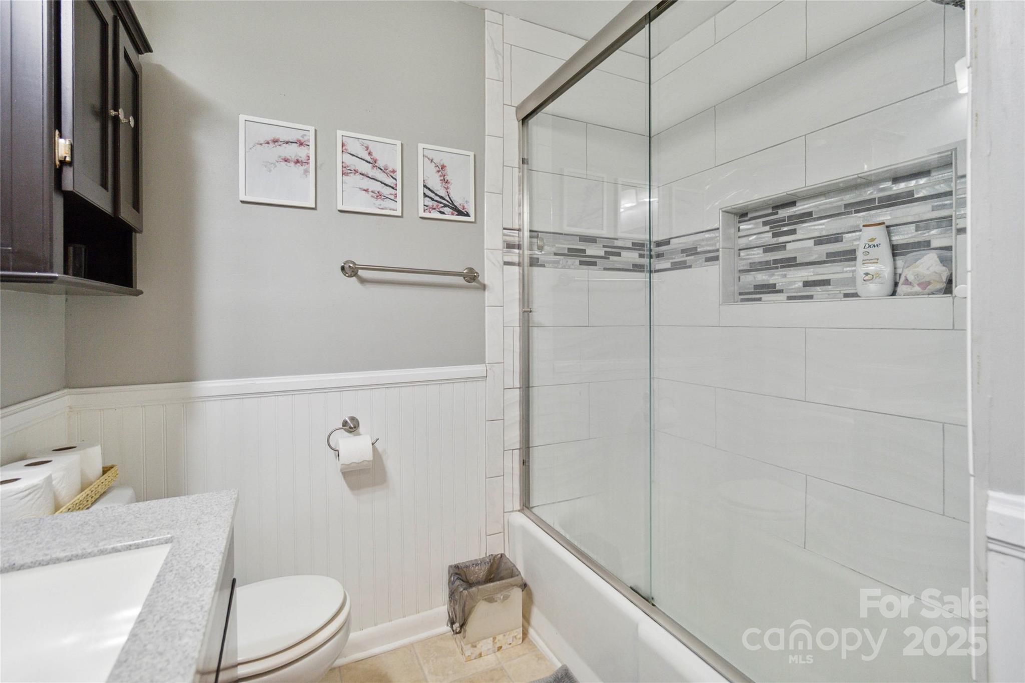 1219 Flowe Drive Matthews, NC 28104 - Photo 22 of 30 a bathroom with a toilet and shower