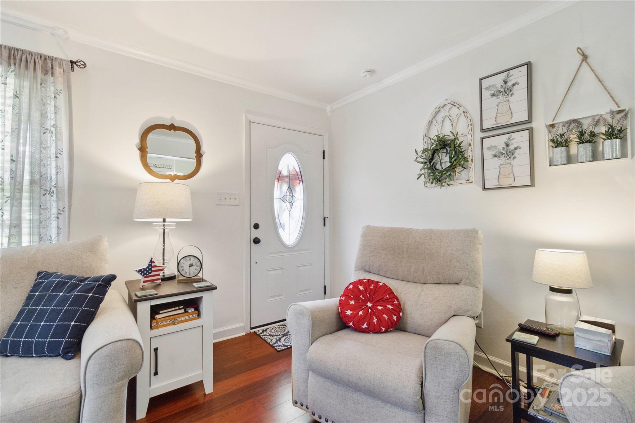 1219 Flowe Drive Matthews, NC 28104 - Photo 5 of 30 a living room with furniture and a lamp