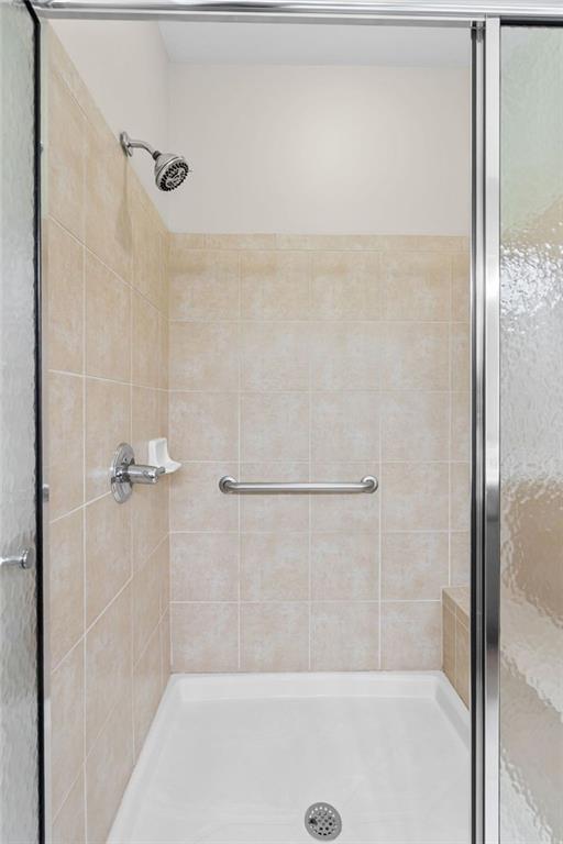 2716 Grapevine Circle Cumming, GA 30041 - Photo 26 of 37 a bathroom with a shower