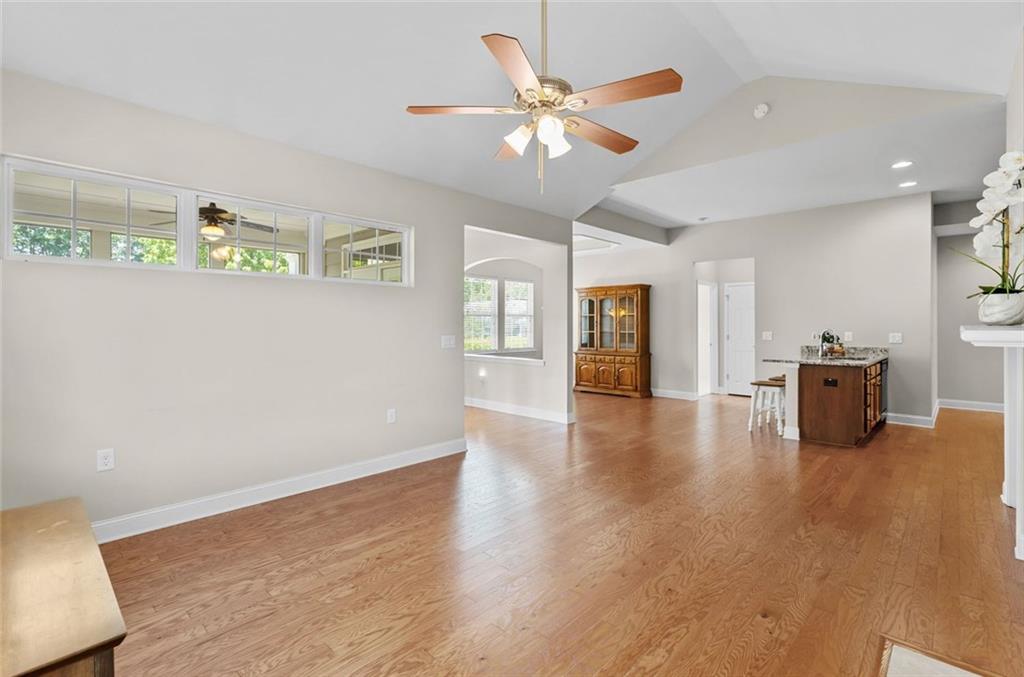 2716 Grapevine Circle Cumming, GA 30041 - Photo 10 of 37 a view of an empty room with window and wooden floor