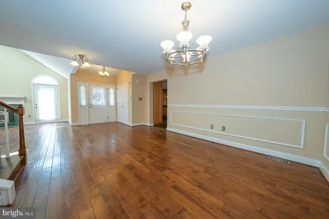 a kitchen with stainless steel appliances granite countertop a refrigerator a sink and a stove