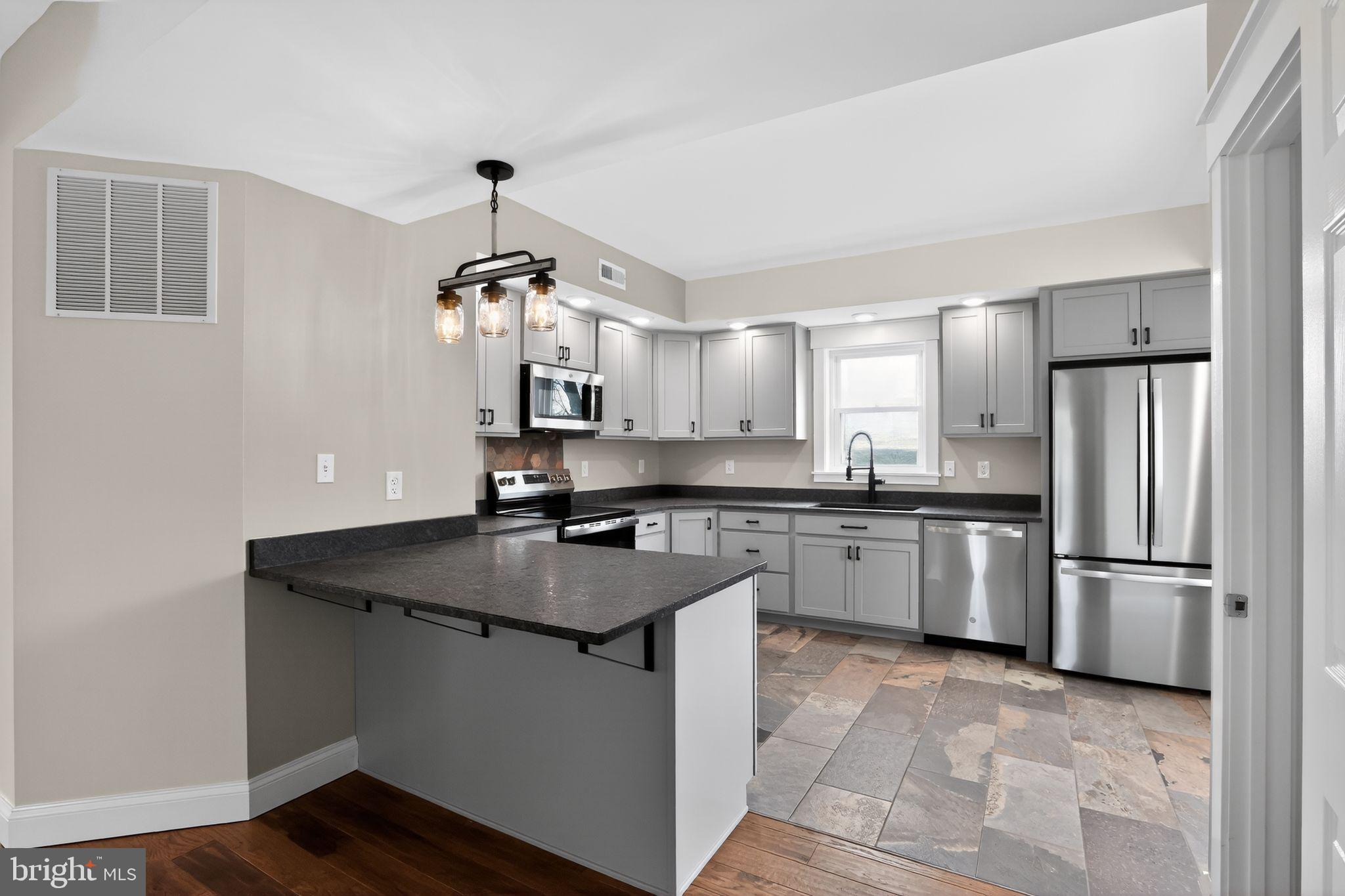 128 Maugers Mill Road Pottstown, PA 19464 - Photo 12 of 42 Modern kitchen with sleek finishes.