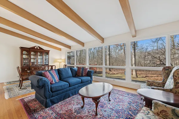 a living room with furniture and a large window