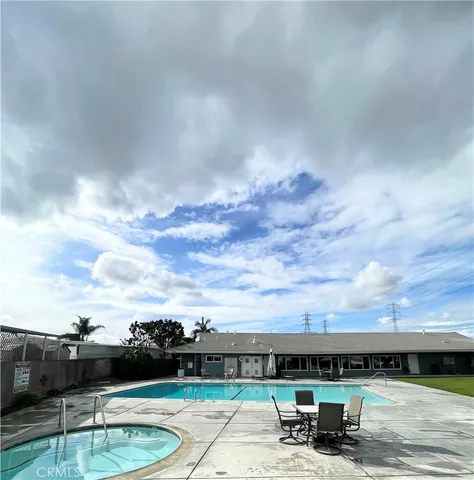 a view of a chair and table in the patio