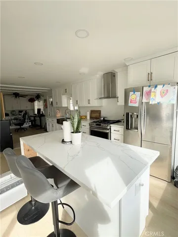 a kitchen with a table and chairs