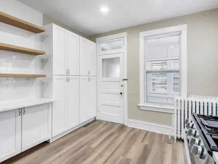 a view of a livingroom with wooden floor